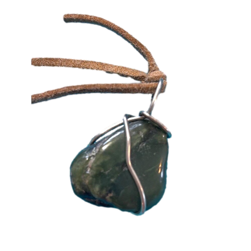 California Jade pendant wrapped in sterling silver wire on leather cord. 12 g.​